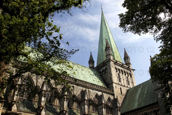 Gothic cathedral with high tower and cloudy sky, Trondheim, Trøndelag, Norway