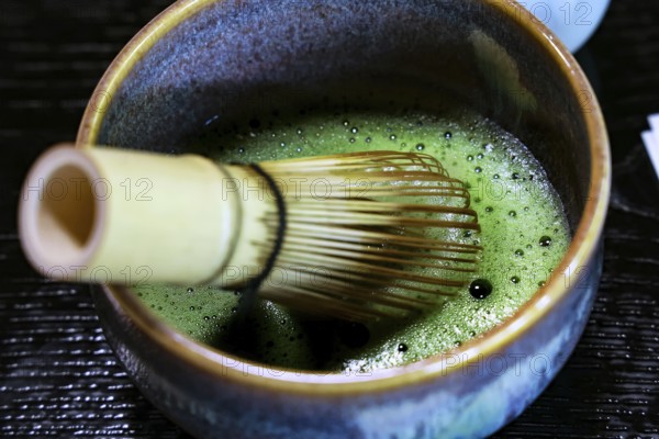 Traditional matcha tea ceremony with a bamboo broom and bowl, Kyoto, Higashiyama, Japan