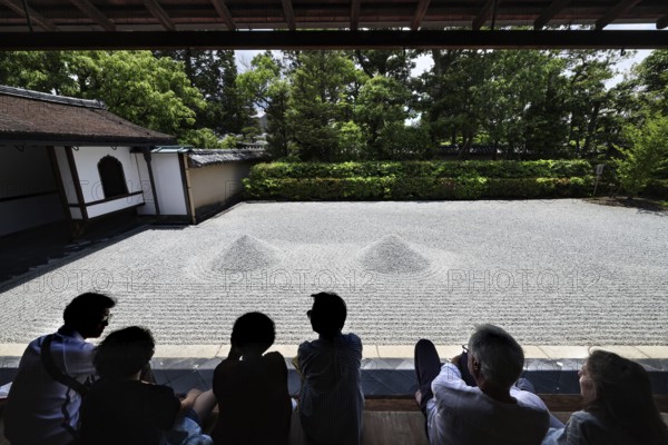 Group of people watching Zen garden with gravel in a temple, Kyoto, Daisen-in, Japan