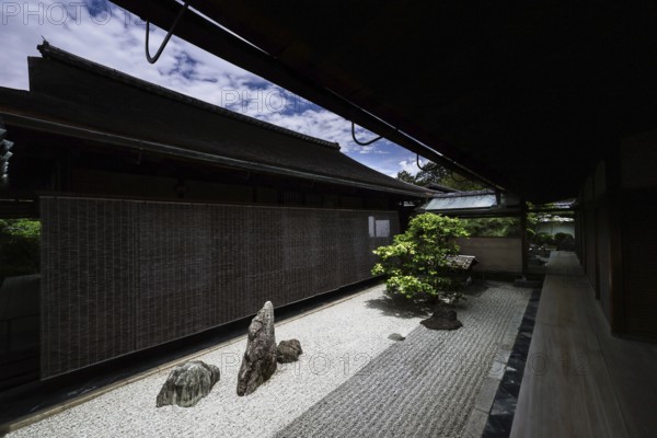 Japanese zen garden in Daisenin Temple with gravel and stones, quiet shade area, Kyoto, Daisen-in, Japan