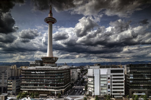 Dramatic clouds over Kyoto Tower with view from Central Station, Kyoto, Kansai, Japan
