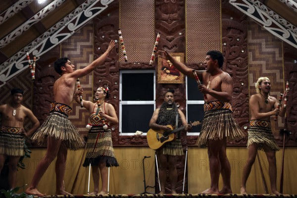 Maori perform a lively dance in traditional dress, Rotorua, Te Puia, New Zealand
