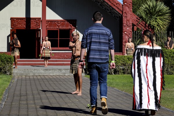Traditional Maori welcome ceremony in front of a cultural house, Rotorua, Te Puia, New Zealand