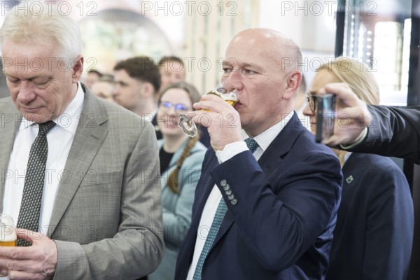 Kai Wegner (Governing Mayor of Berlin, CDU) drinks beer at the Green Week on the exhibition grounds in Berlin on 16 January 2026. The trade fair for the agricultural and food industry will take place from 16-25 January 2026