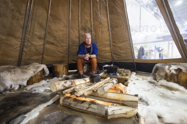A person is sitting in a teepee at the Norwegian stand at the Green Week at the exhibition center in Berlin on 16.01.2026. The Agricultural and Food Industry Fair will take place from January 16-25, 2026