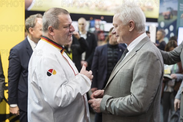 Roland Ermer (President of the Zentralverband des Deutschen Bäckerhandwerks e.V.) and Alios Rainer (Federal Minister of Agriculture, Food and Home Affairs) at the stand of the German Guild Bakers during the opening tour of the Green Week at the exhibition grounds in Berlin on 16 January 2026. The trade fair for the agricultural and food industry will take place from 16 to 25 January 2026