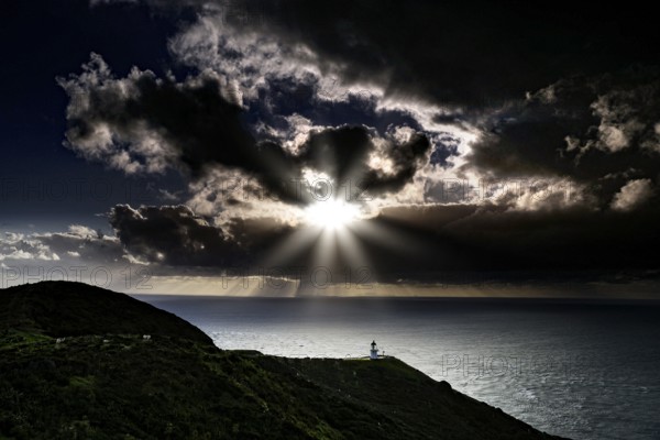 Mystical coastal landscape near Cape Reinga with dramatic sunset and clouds, Cape Reinga, Northland, New Zealand