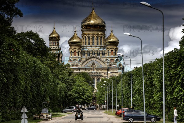 Impressive church with golden domes in Karosta, surrounded by green trees, Liepaja, Courland, Latvia