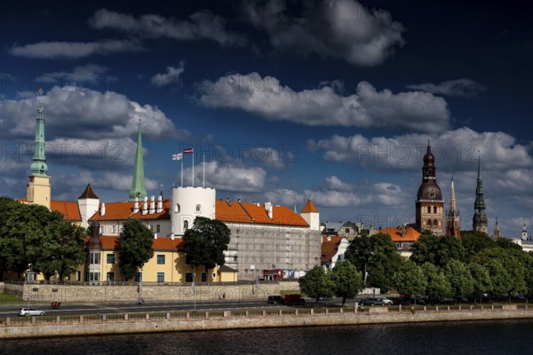 View of Riga Castle and Church Towers over the Düna under cloudy sky, Riga, Vidzeme, Latvia