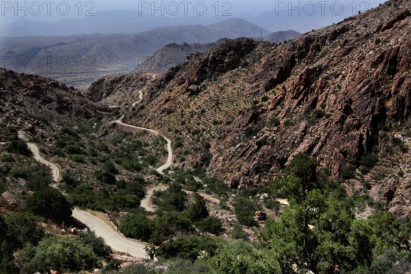 Curvy road through a vast, dry mountain landscape, Anergui, zero, Morocco