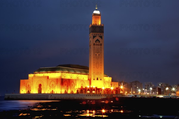 Illuminated Hassan II mosque at night, magnificent architecture on the coast of Casablanca, Casablanca, zero, Morocco