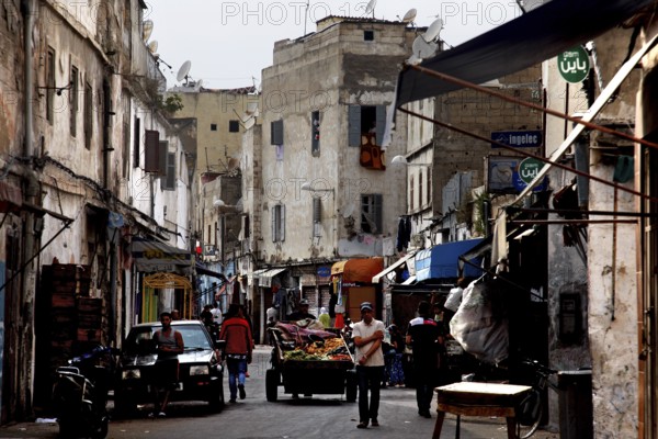 Narrow street with old buildings and traditional city life, Casablanca, Grand Casablanca, Morocco
