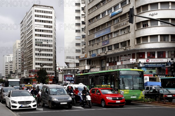 Busy street with heavy traffic and tall buildings, Casablanca, Casablanca-Settat region, Morocco