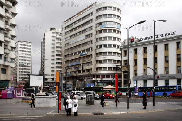 Urban scene with tall buildings, people and road traffic, Casablanca, Casablanca-Settat region, Morocco