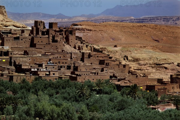 Clay buildings in Ait Benhaddou surrounded by lush vegetation, Ait Benhaddou, Ouarzazate, Morocco