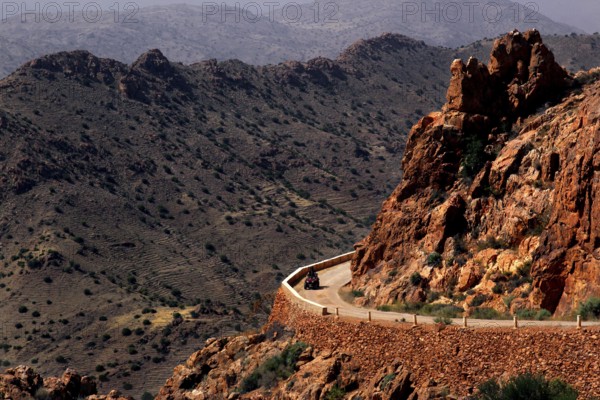 Road snakes through a rocky, dry mountain landscape, Anergui, zero, Morocco