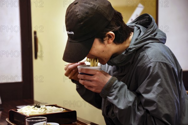 Person enjoying SOBA noodles at a restaurant in Kurashiki, Kurashiki, Okayama, Japan