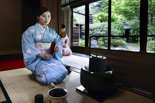 Tea master in traditional kimono during a tea ceremony, Kyoto, Higashiyama, Japan
