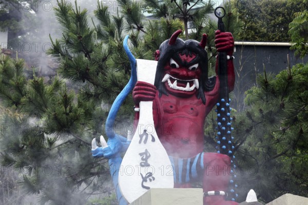 Colourful devil sculpture with steam in Kamado Jigoku in Beppu, Beppu, Kyushu, Japan