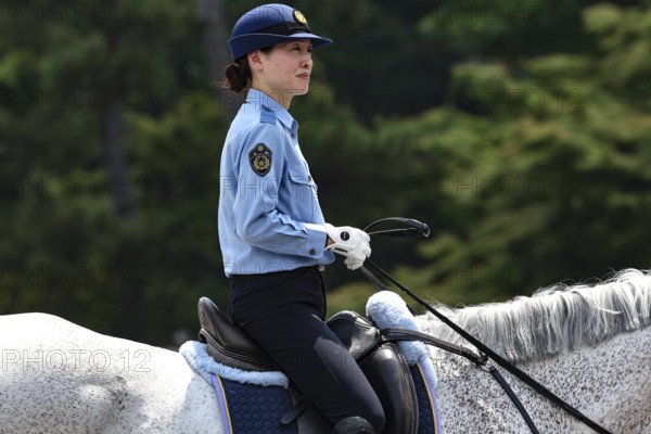 Mounted policewoman in uniform at Aoi Matsuri in Kyoto, Kyoto, Japan