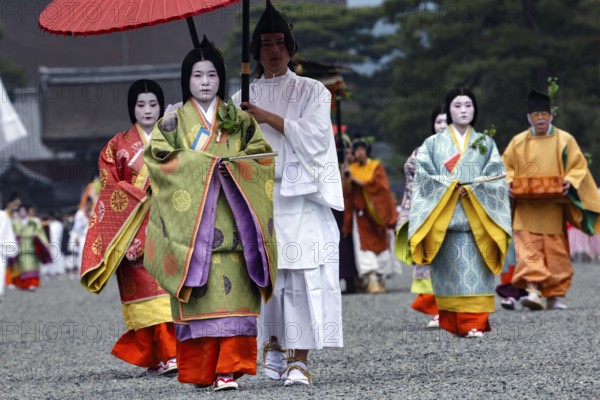 Geishas in traditional dress during the Aoi Matsuri procession, Kyoto, Japan