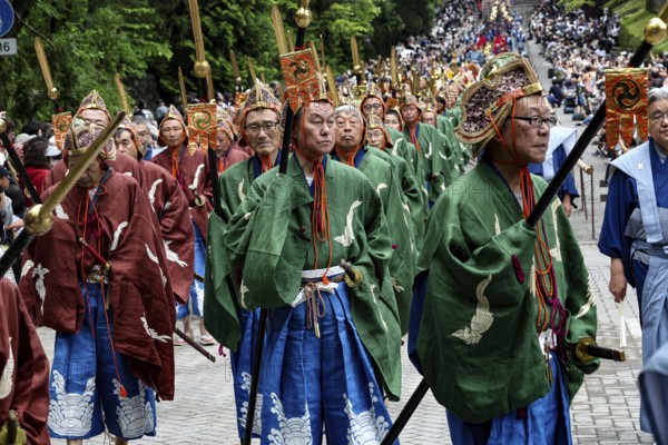 Traditionally dressed warriors march in a ceremony in Nikko, Nikko, Japan