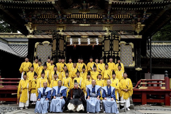 Group photo of Shinto priests in front of Toshogu shrine in Nikko wearing festive clothes, Nikko, Tochigi, Japan