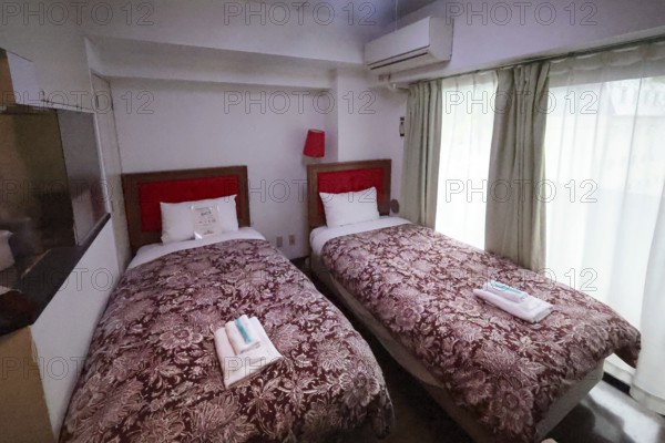 Hotel room with twin beds, brown blankets and red headboard, Nikko, null, Japan