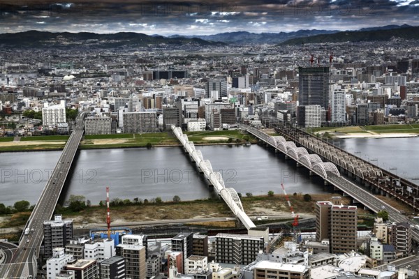 View from Umeda across the river with several bridges and thick clouds, Osaka, Umeda, Japan