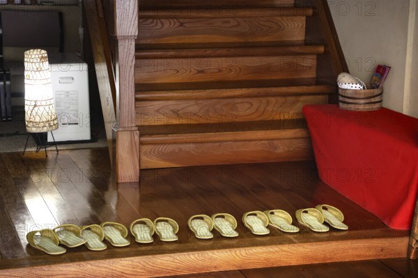 Shoes in the entrance area of a ryokan in Yamanouchi, Yamanouchi, Japan