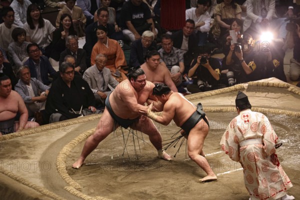 Sumo rangers in intensive duel in Kokugikan, Tokyo, Ryogoku, Japan