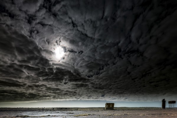 Abandoned station in gloomy sky with dramatic clouds in the outback, Oodnadatta Track, null, Australia