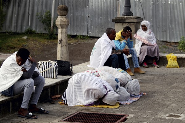 People gather praying in front of a church in Addis Ababa, Addis Ababa, Ethiopia
