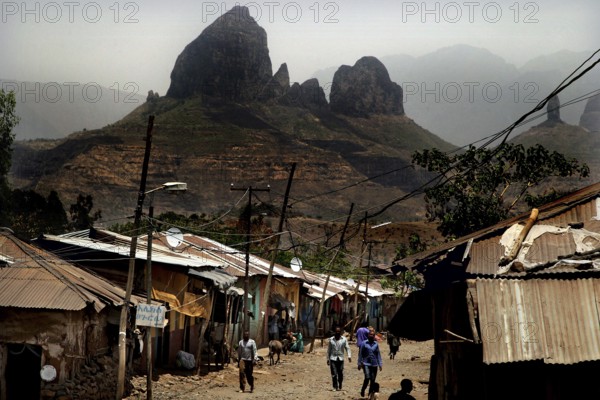 Village life in Adi Arkay against a majestic mountain backdrop