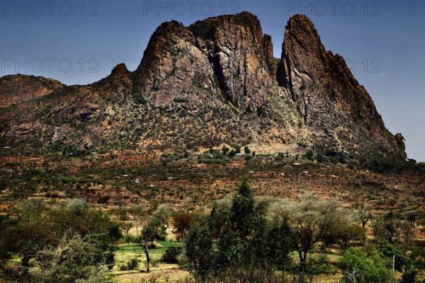 Impressive mountain range with sparse vegetation and clear skies, Adua, Tigray, Ethiopia