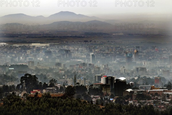 Expansive city view with mountains in the background, surrounded by haze, Addis Ababa, Ethiopia