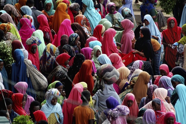 Large crowd in colorful clothes at a market in Awaday, Awaday, Ethiopia