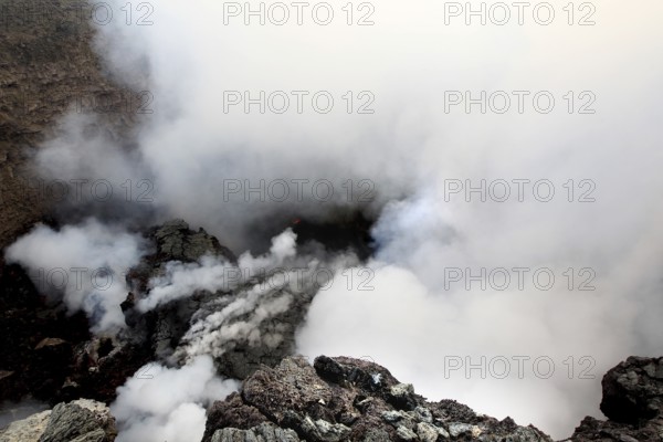 Smoke and steam rise from the crater of a volcano, Erta Ale, Ethiopia
