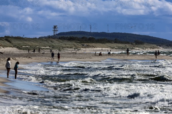 Beach visitors enjoy sunny weather at sea, Nida, Lithuania
