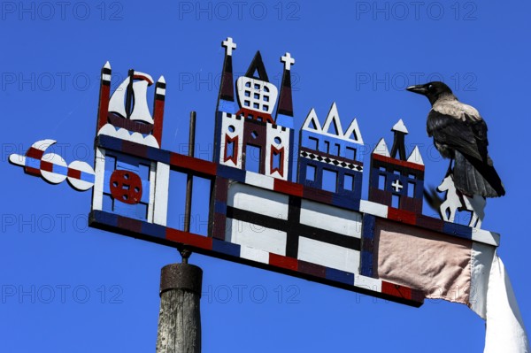 Colourful Kuren pennant with a bird on a bright sky, symbolism of the Curonian Spit, Nida, Curonian Spit, Lithuania