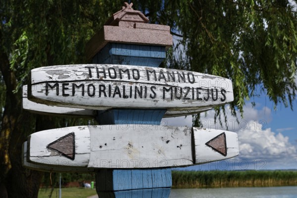 Wooden sign for the Thomas Mann Museum in Nida in front of a tree backdrop, Nida, Lithuania