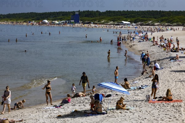 Busy beach in Palanga with people enjoying summer weather, Palanga, Klaipeda County, Lithuania