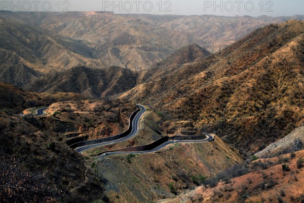 Serpentine road snakes through the barren Semien Mountains