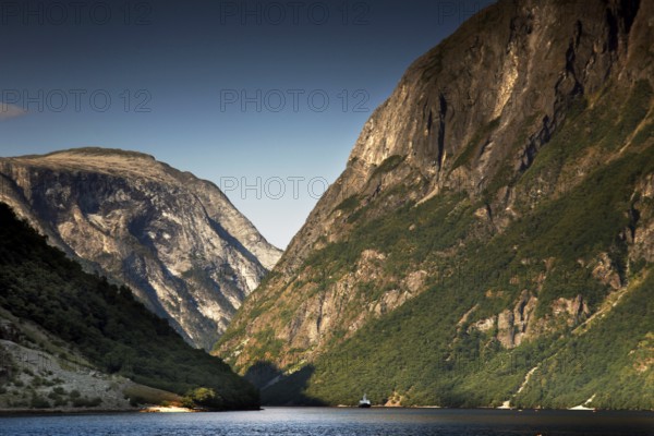 Majestic panorama of Nærøyfjord near Gudvangen with high mountains and still water, Gudvangen, Norway