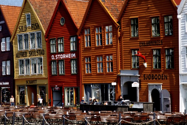 Colourful wooden houses in the Tyskebryggen Hanseatic Quarter in Bergen with lively cafés and shops, Bergen, Norway