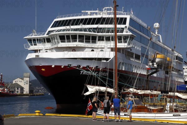 Hurtigruten ship in Bergen harbour, passenger ready people on deck, Bergen, Norway, zero