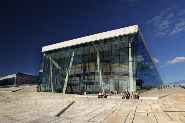 Glass façade of Oslo Opera, an architectural masterpiece in the Bjøvika district under clear skies, Oslo, Bjøvika, Norway