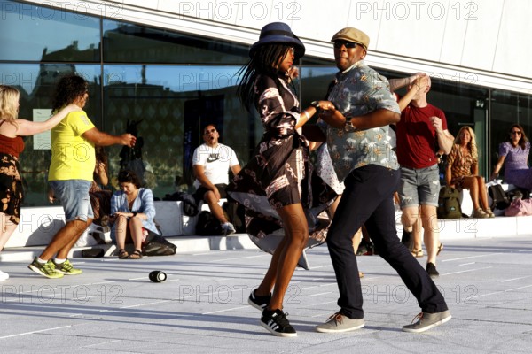 Moving dance couples dance full of energy in front of the opera in Oslo, Oslo, Bjøvika, Norway