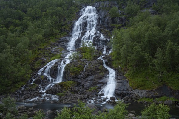 Summer day visiting Espelandsfossen falls near Bergen, scenic nature and flowing water, Vestland, Norway