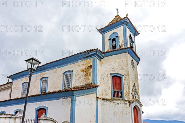 Clouds over an old Baroque church in the historic city of Mariana, Minas Gerais, Mariana, Minas Gerais, Brazil